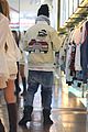 justin bieber attracts a mob of fans while out shopping 03