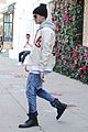 justin bieber attracts a mob of fans while out shopping 15