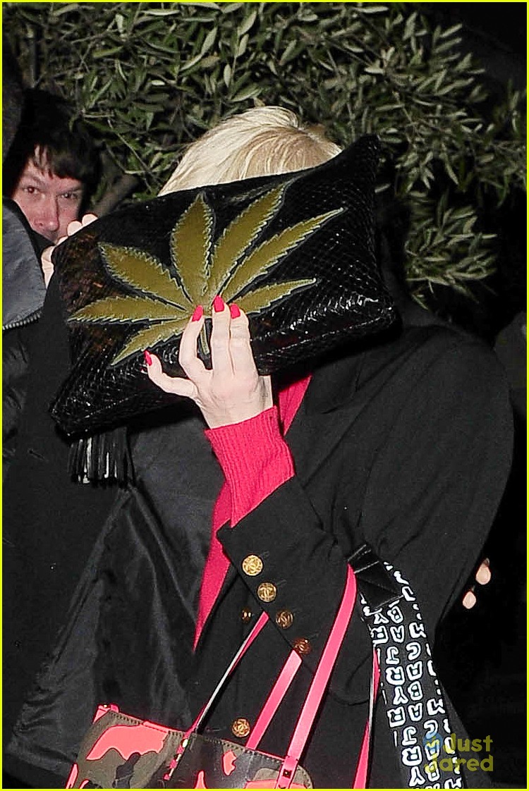 miley cyrus enters club fully clothed leaves in bra 07