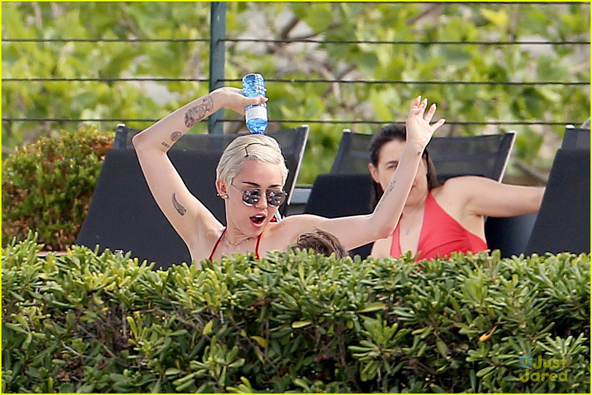miley cyrus wears a bikini douses herself with water 11
