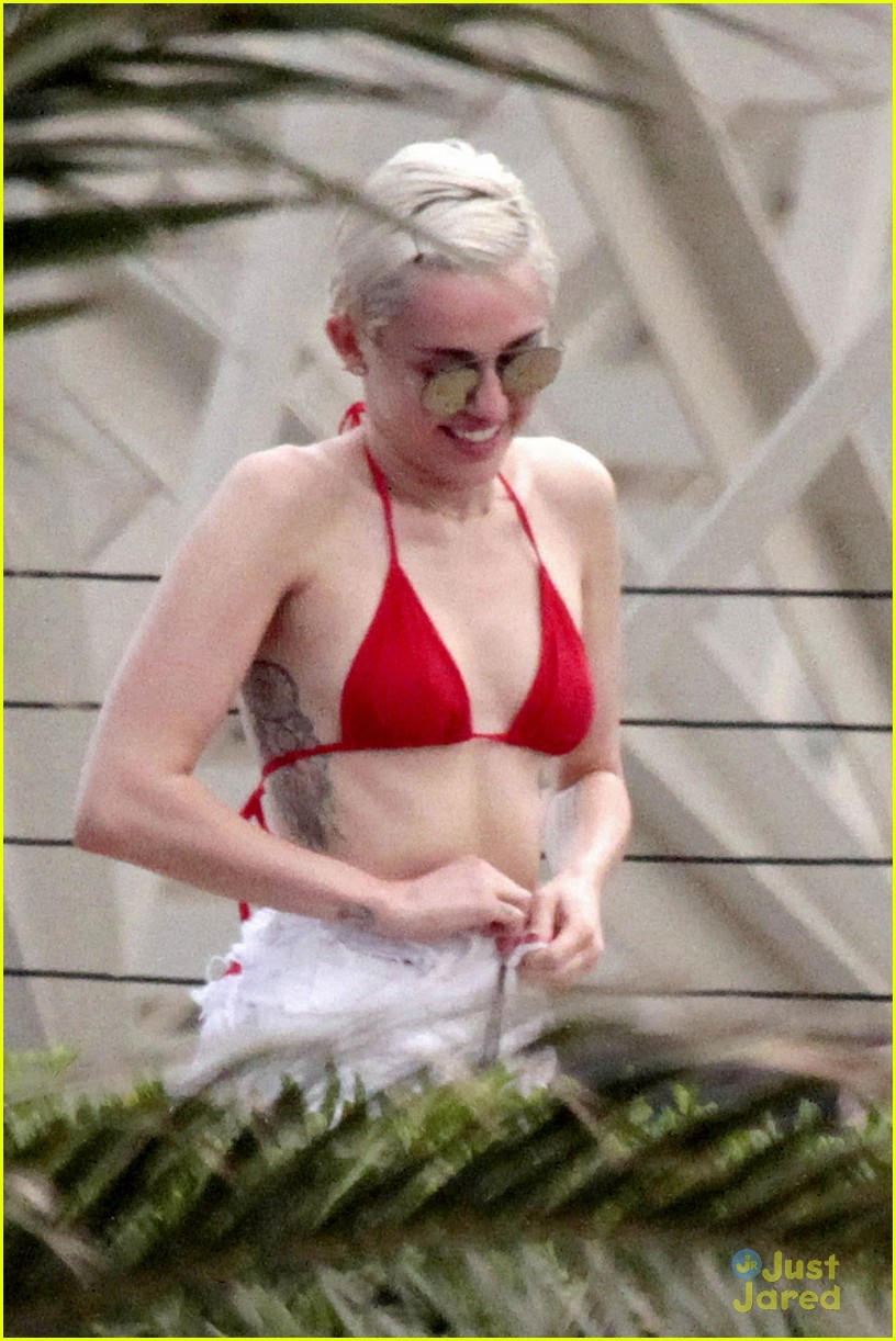 miley cyrus wears a bikini douses herself with water 27