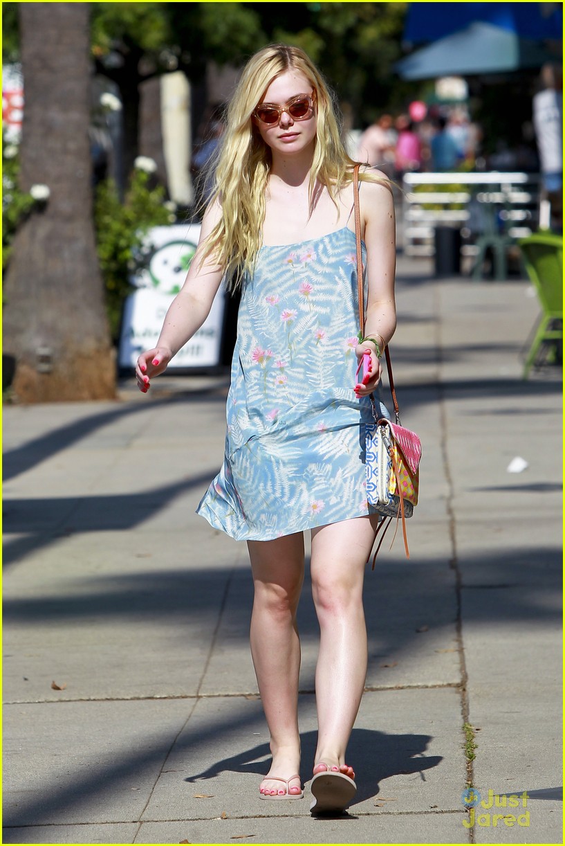 Elle Fanning looks chic in casual looks in navy culottes and a