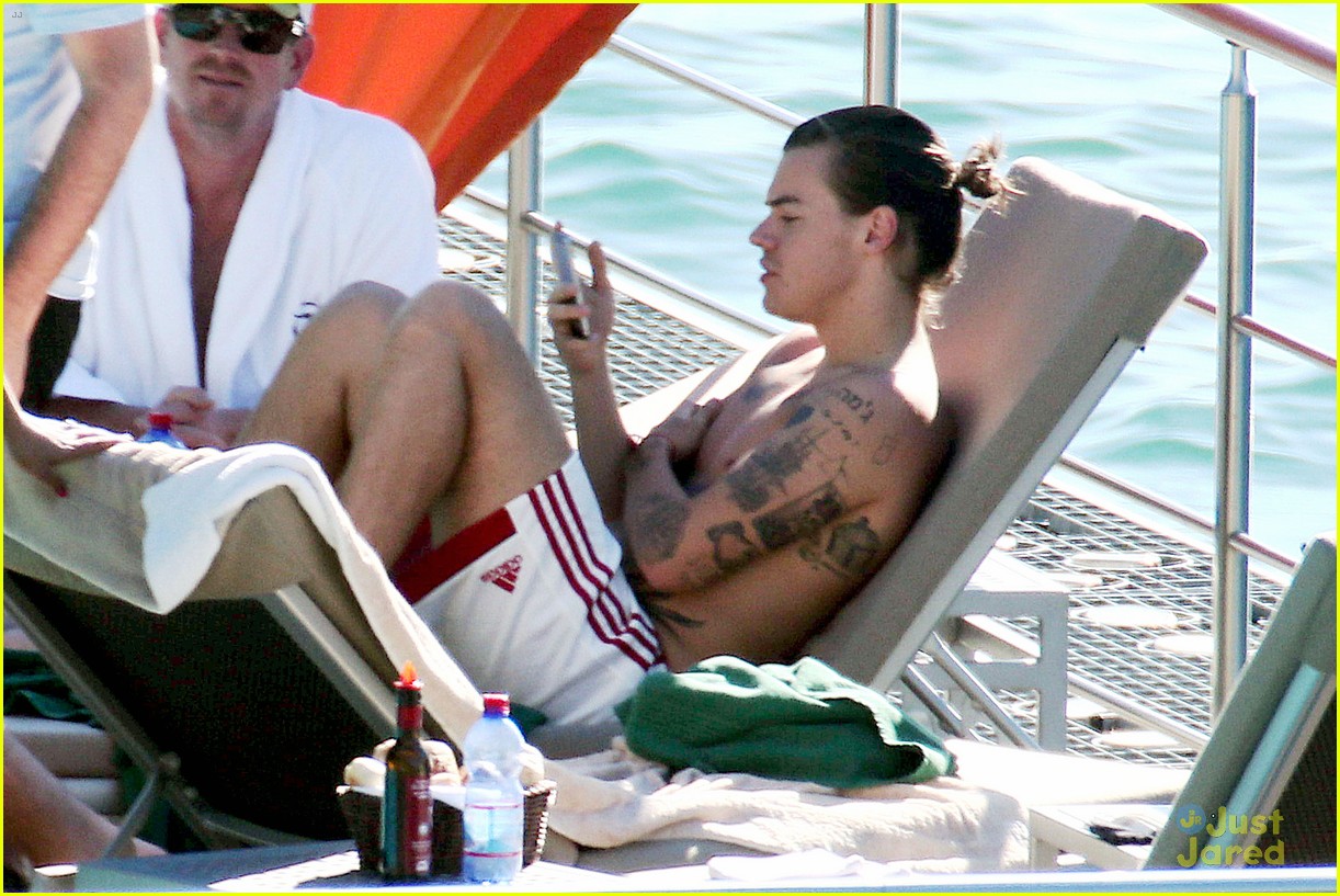 harry styles shirtless ponytail pool italy 03