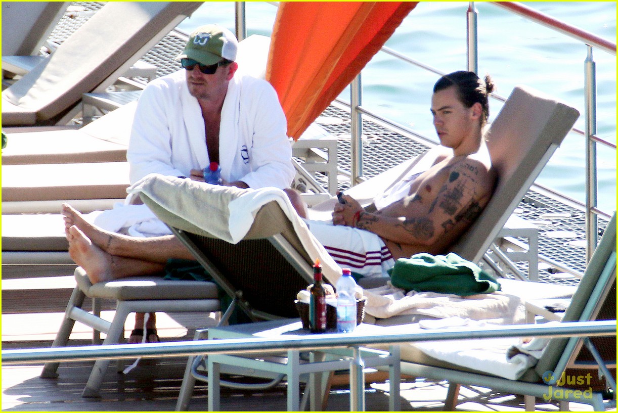 harry styles shirtless ponytail pool italy 08