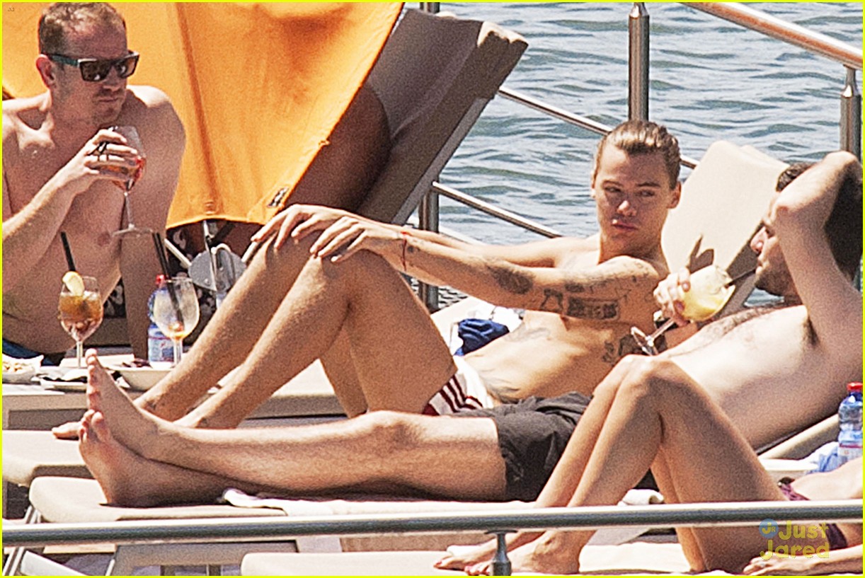 harry styles shirtless ponytail pool italy 11