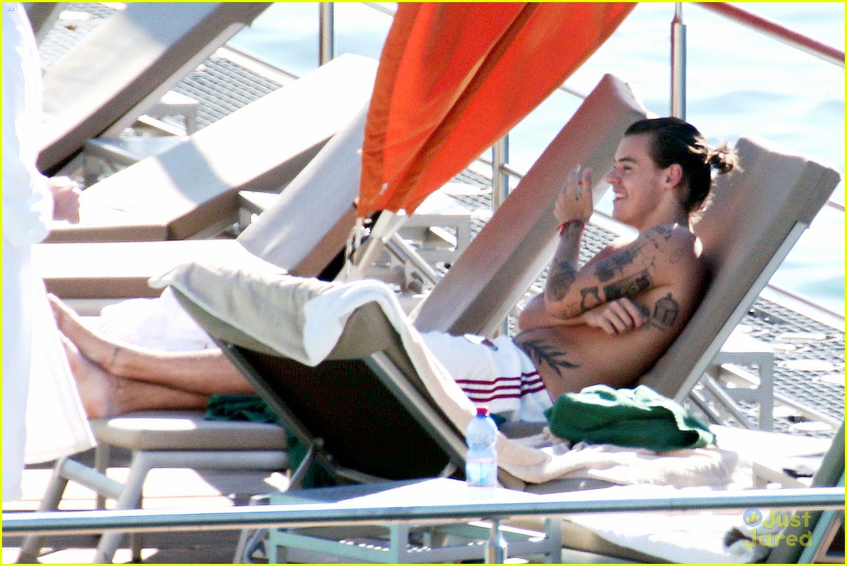 harry styles shirtless ponytail pool italy 19