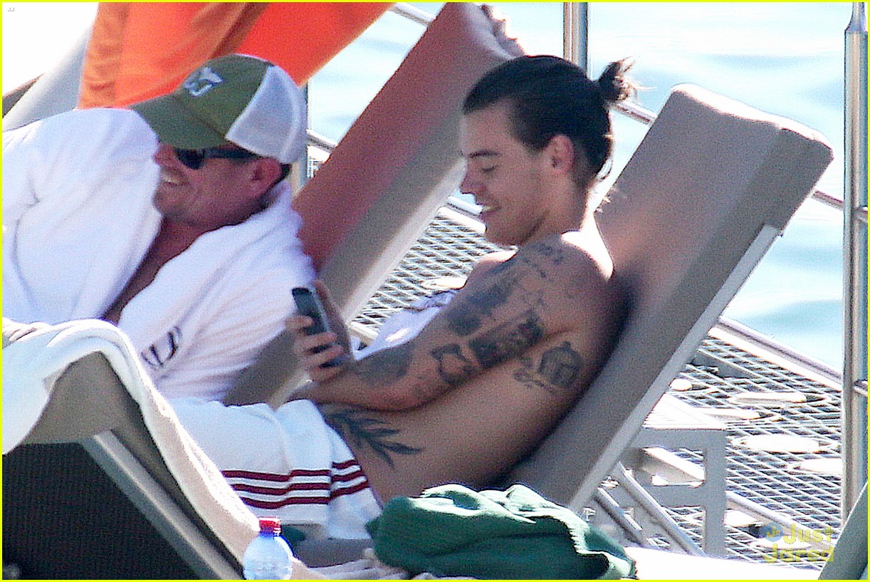 harry styles shirtless ponytail pool italy 20