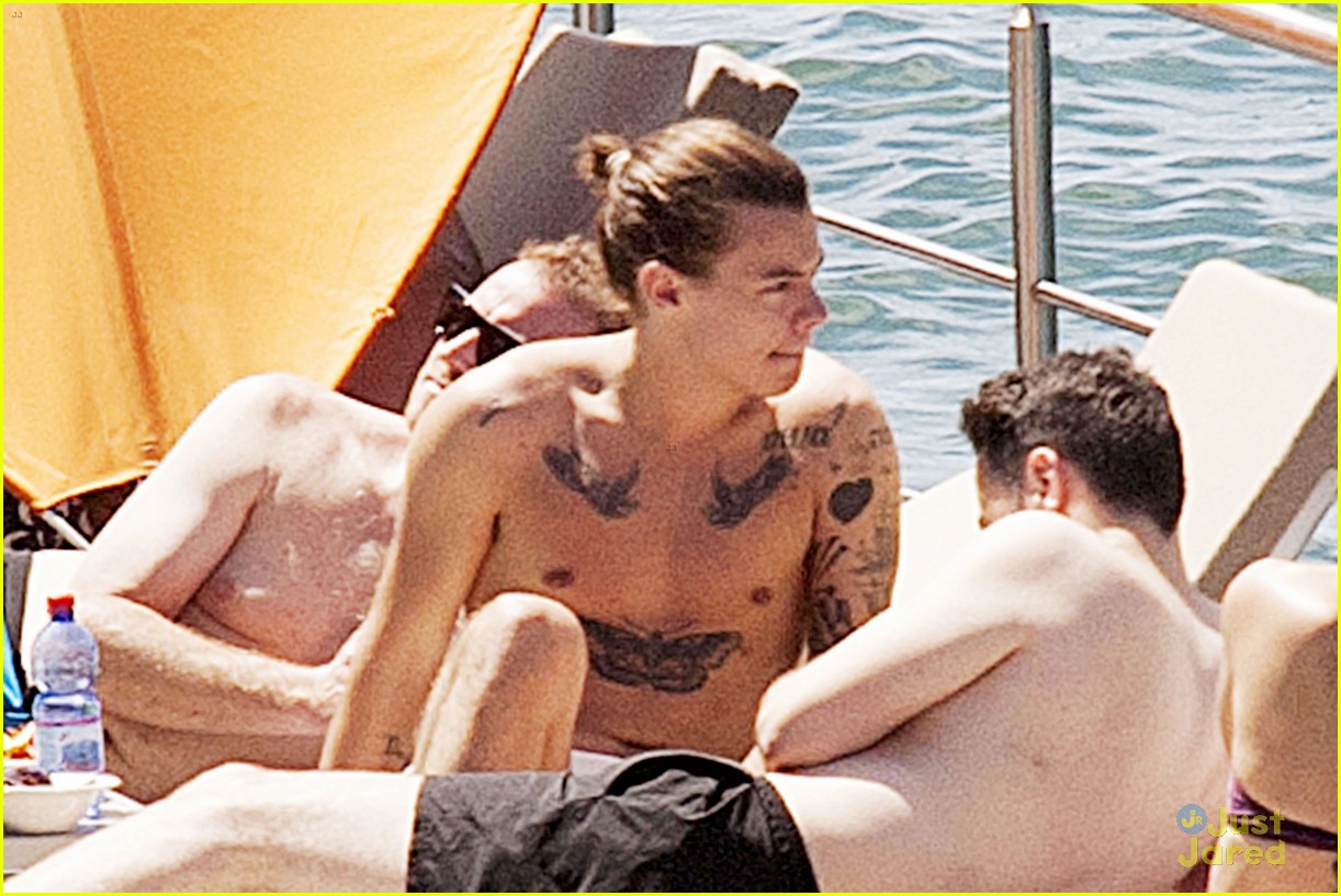 harry styles shirtless ponytail pool italy 22