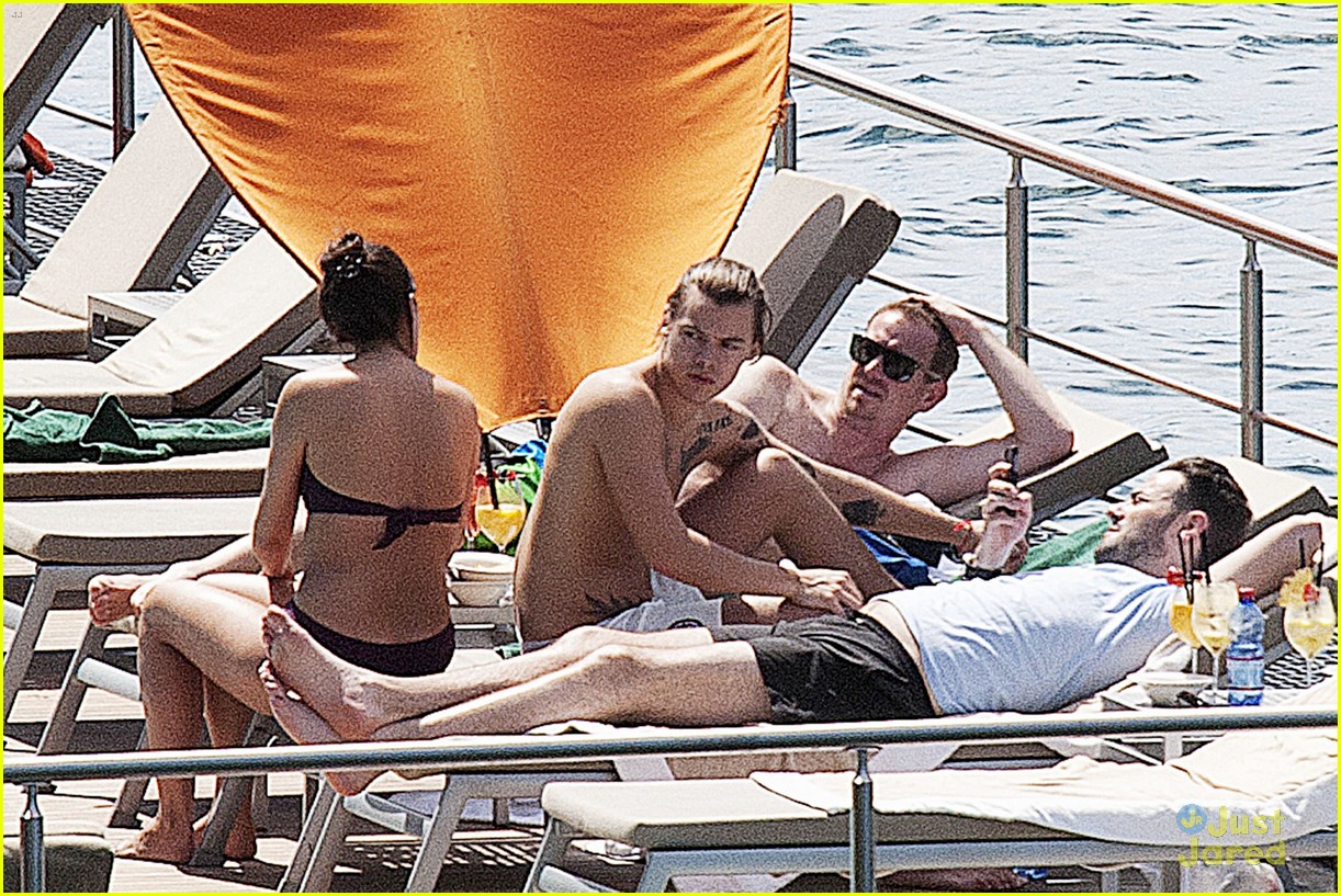 harry styles shirtless ponytail pool italy 23