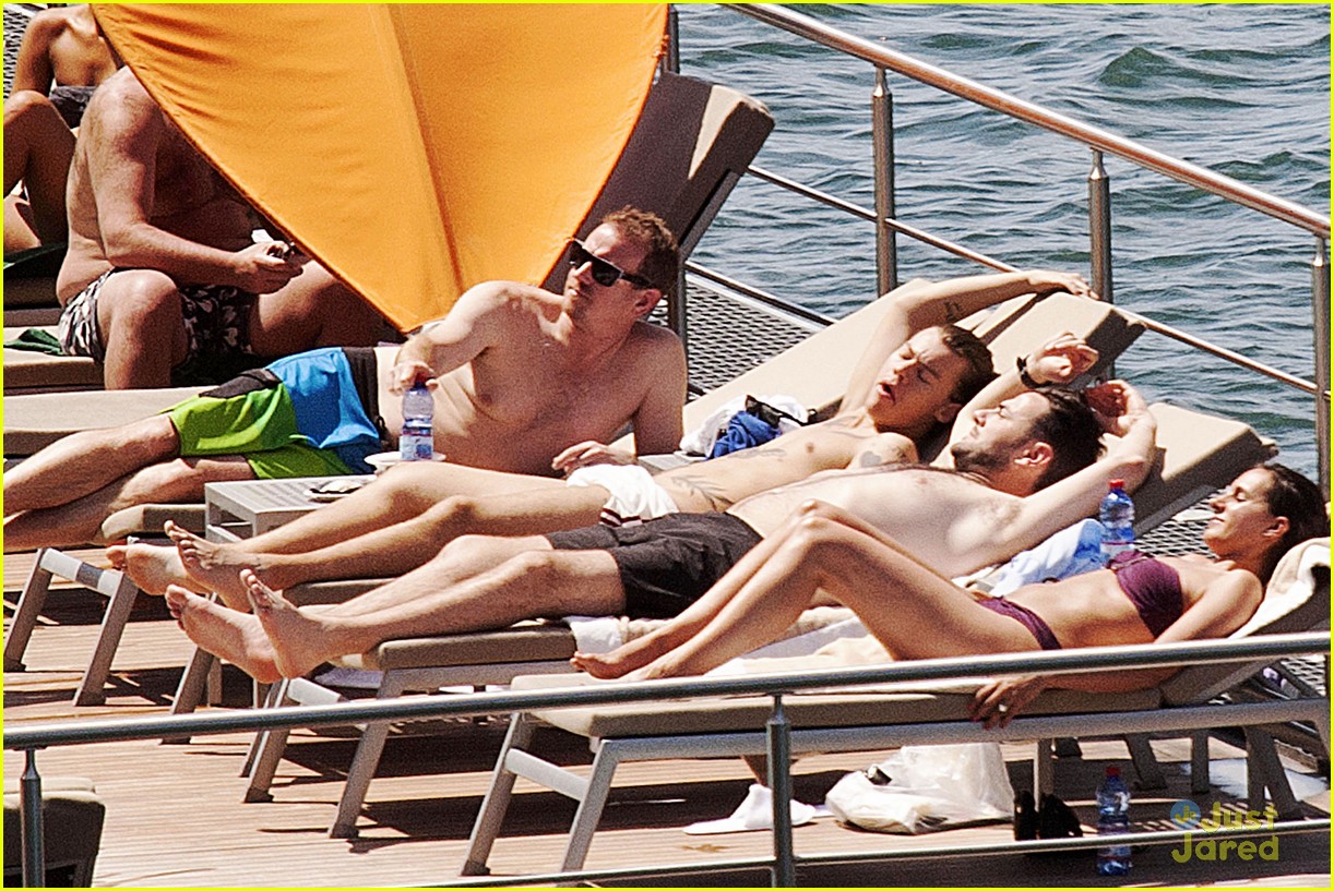 harry styles shirtless ponytail pool italy 29