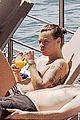 harry styles shirtless ponytail pool italy 12