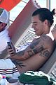 harry styles shirtless ponytail pool italy 20