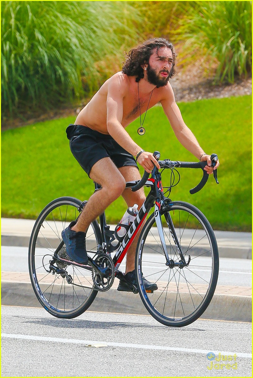 mateo arias shirtless bike ride beard long hair 03
