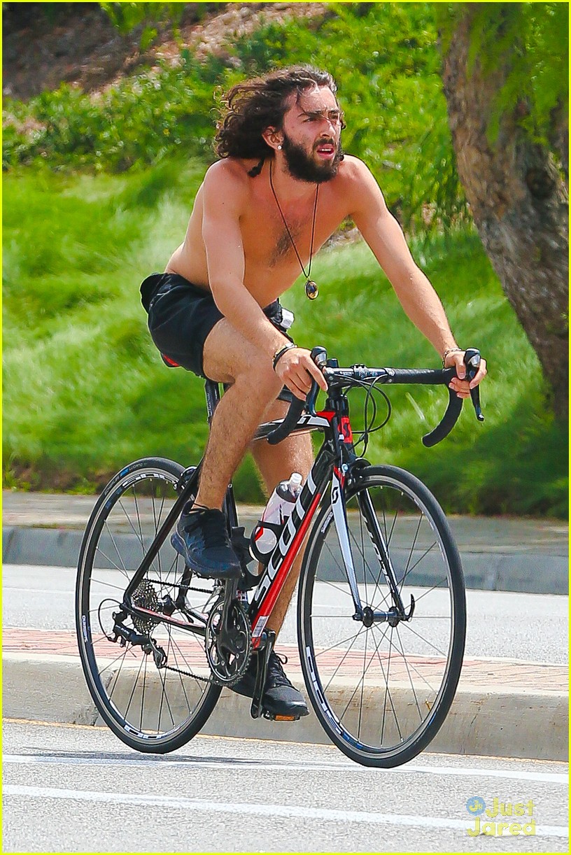 mateo arias shirtless bike ride beard long hair 06