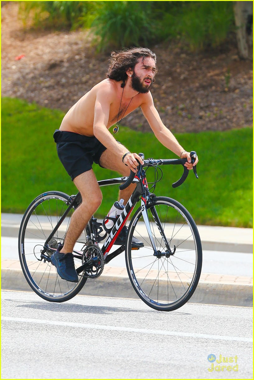 mateo arias shirtless bike ride beard long hair 10