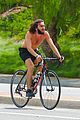 mateo arias shirtless bike ride beard long hair 01