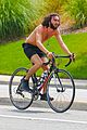 mateo arias shirtless bike ride beard long hair 03