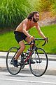 mateo arias shirtless bike ride beard long hair 09