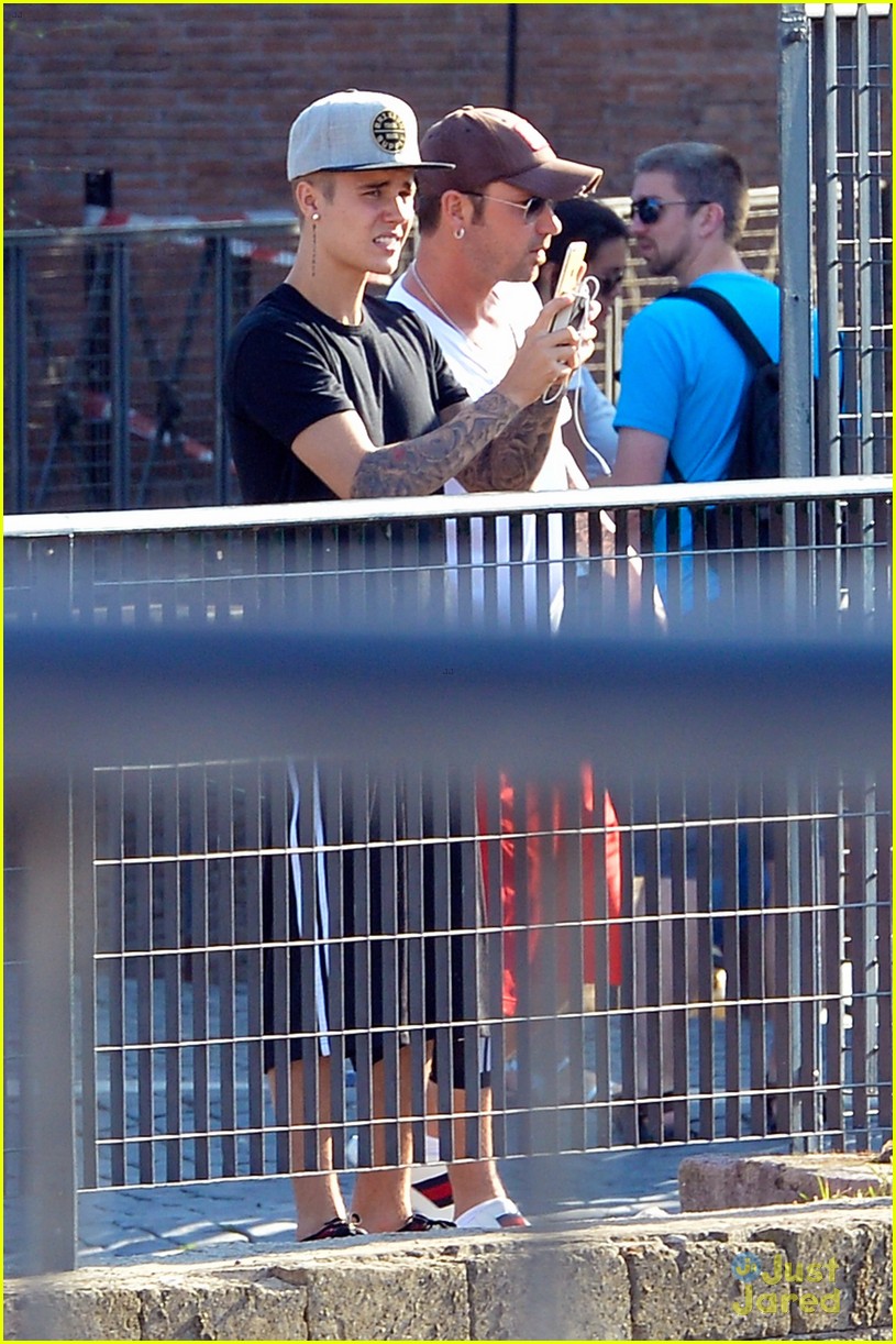 justin bieber cant help taking pics of rome 16