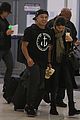 orlando bloom selena gomez walks steps apart from each other at the airport 01
