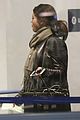 orlando bloom selena gomez walks steps apart from each other at the airport 03