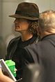 orlando bloom selena gomez walks steps apart from each other at the airport 05