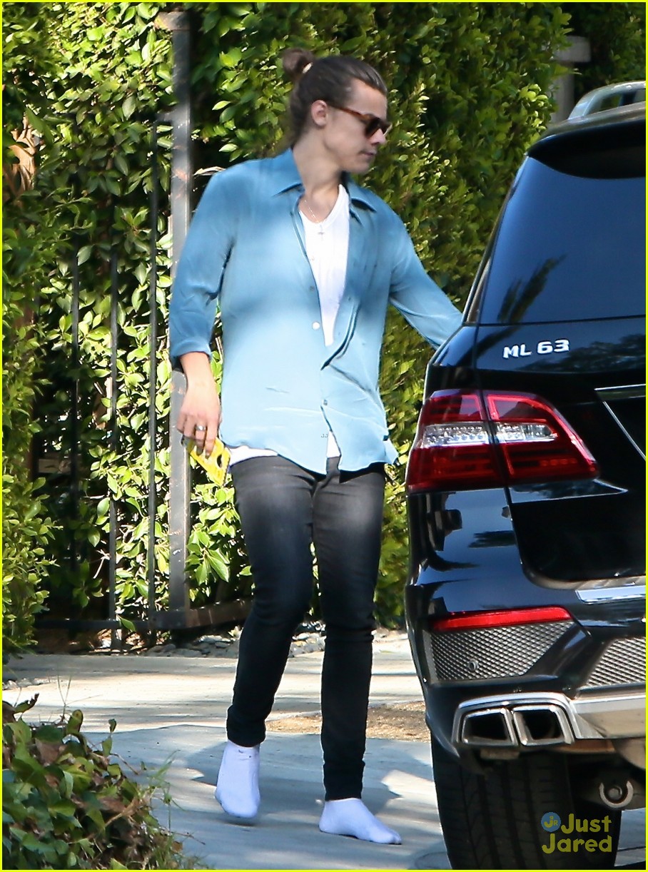 harry styles steps out before taylor swift out of woods drops 28