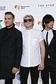 one direction guys pull off sleek red carpet fashion at aria awards 19