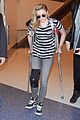 chloe moretz knee brace crutches lax arrival 04