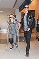 chloe moretz knee brace crutches lax arrival 05