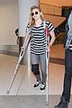 chloe moretz knee brace crutches lax arrival 06