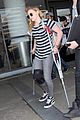 chloe moretz knee brace crutches lax arrival 07