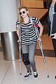 chloe moretz knee brace crutches lax arrival 12
