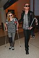 chloe moretz knee brace crutches lax arrival 20