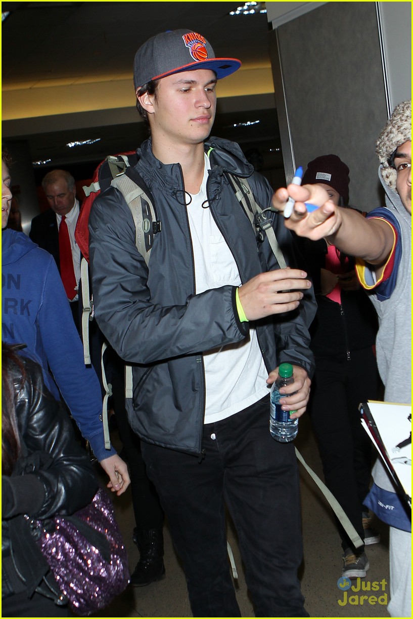 ansel elgort poses with fans airport 10