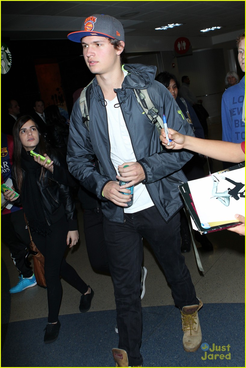 ansel elgort poses with fans airport 14