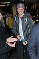 ansel elgort poses with fans airport 08