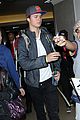 ansel elgort poses with fans airport 10