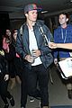 ansel elgort poses with fans airport 15