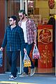 liam hemsworth picks up beer with his buddy in australia 03