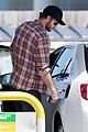 liam hemsworth thumbs up pumping gas 05