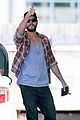 liam hemsworth thumbs up pumping gas 07