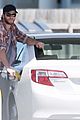 liam hemsworth thumbs up pumping gas 08
