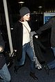emma stone lands in los angeles before 2015 golden globes 03