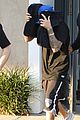 justin bieber covers hair with two cushions after salon visit 02
