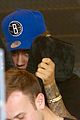 justin bieber covers hair with two cushions after salon visit 06