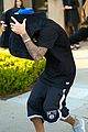 justin bieber covers hair with two cushions after salon visit 08