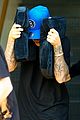 justin bieber covers hair with two cushions after salon visit 11
