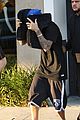 justin bieber covers hair with two cushions after salon visit 16
