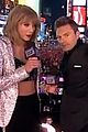 taylor swift warms up with ryan seacrests coat on new years eve 02